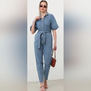 Banny Denim Short Sleeve  Jumpsuit With Pockets Buttons And A Tie Waist Small